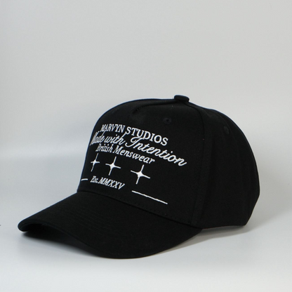 Black cap with white text and branding on a light gray background