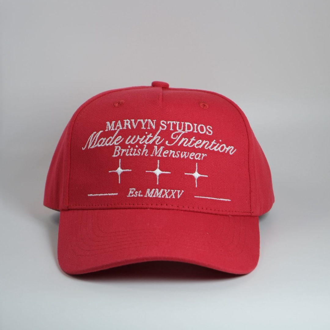 Red cap with white text on a gray background